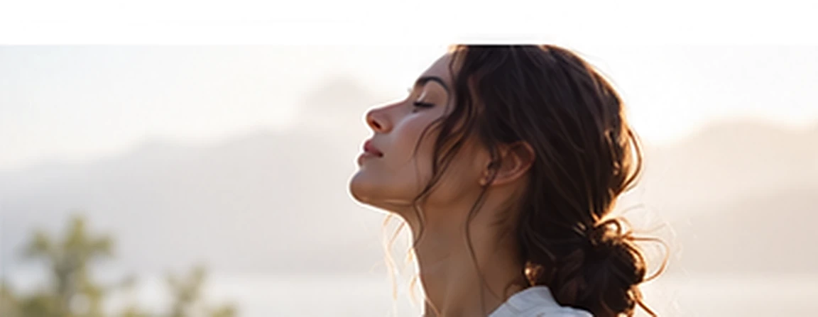 Woman breathing peacefully in soft morning light